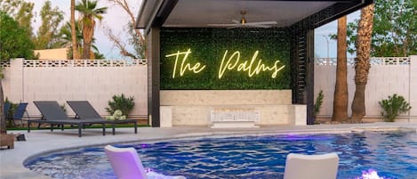 Palms pool area heated. Please note the firepit isn’t working under neon sign 