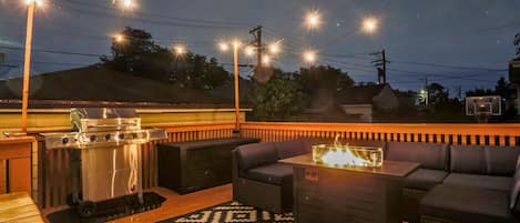 The large, private, back deck is the perfect place to be at night