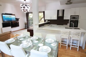 Dining Table, Opens to North facing Terrace with outdoor setting.
