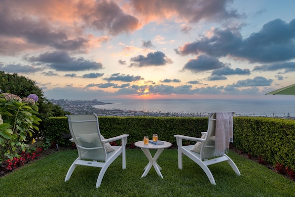 Watch the sun set over the water from the side terrace.