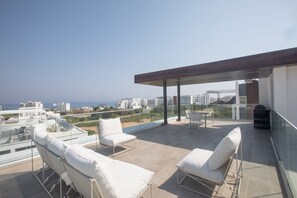 Roof Terrace with Seating and dining area overlooking the views