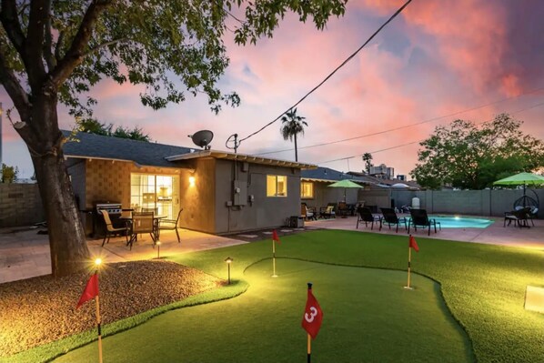 Backyard putting green and pool