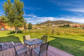 Back patio with BBQ grill and view of the 9th green.