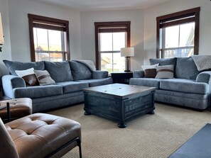 Spacious living room with views of the village.
