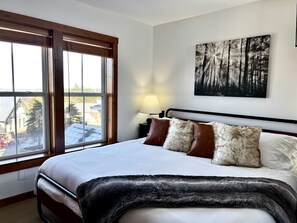 Rest up after a long day in this super comfy king bed with great village views. 