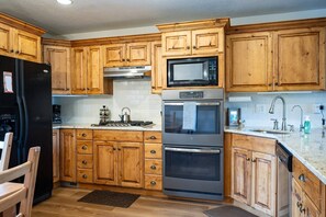 Cook your favorite meals in a kitchen bathed in natural light that enhance the culinary experience.
