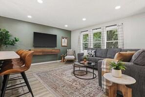 Open concept living, dining and kitchen area.