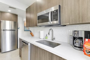 Kitchen is well stocked with all the pots, pans, utensils, dishes you need for cooking and baking as well as common staples and coffee