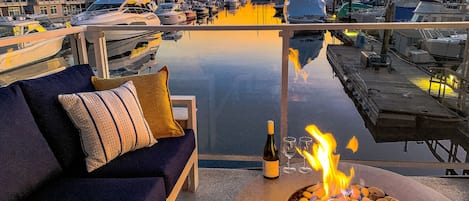 Welcome to Sailor's View! A bottle of wine at dusk around the fire table as the downtown Vancouver skyline lights up,  is a great way to end any day.