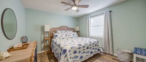 Beautifully decorated main bedroom with king-size bed.