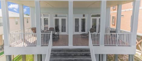 Bama Boat Duplex - South has a private balcony with steps to the yard.