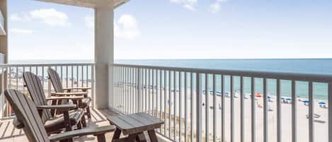 Relax on your private balcony with beautiful beach views