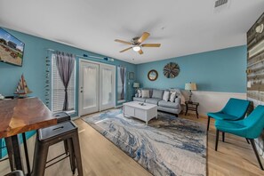 Living area with sleeper sofa & patio access