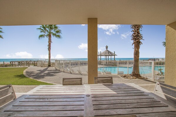 Private patio is steps to the pool