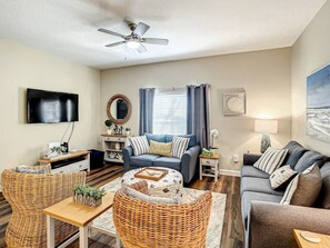 Comfortable and well appointed living room with plenty of seating, perfect for gathering, relaxing, and enjoying time together after a day of adventure.