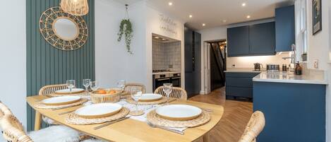 Stunning dining space for 6 in the modern open plan kitchen with bi-fold doors.