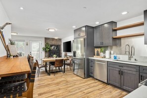 Ascending upstairs to each of the main floors, you will find the fully renovated and stocked kitchen.