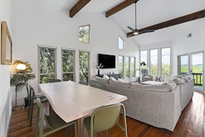 Elegant 6-seater dining space with a stunning view, right next to the comfy living area.