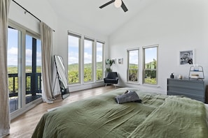 Dreams meet reality in your private master bedroom with a king-sized bed and balcony access.