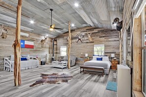 The bedroom boasts rustic character with cozy embellishments
