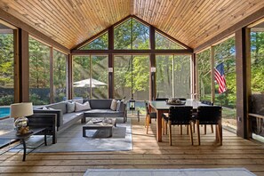Soak in the outdoors with our floor to ceiling windows enclosed patio.