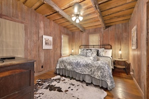 King bed in the rustic bedroom.