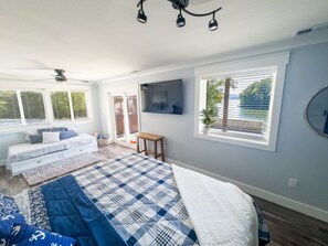 Primary bedroom looking out over the lake.