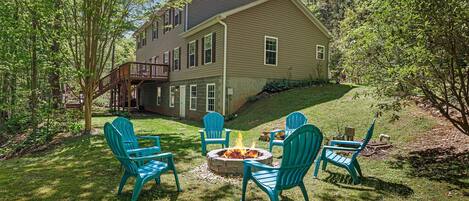 Unwind by the fire pit in the spacious and secluded back yard. 