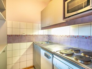 Prepare a meal in the equipped kitchen.