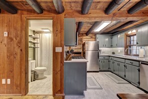 Newly remodeled kitchen with quartz countertops and stainless appliances