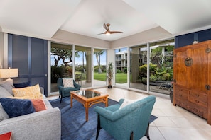 This immaculate unit is bathed in natural light, showcasing a vibrant decor palette, and promises a pristine and comfortable stay for your Hawaiian getaway.