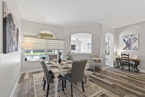 Savor the Moment: Elegant Dining Room Overlooking the Pool