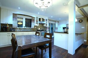 The kitchen and dinning table, Island and cabinets.