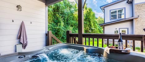 Unwind in the private hot tub under a starlit sky for the ultimate relaxation experience.