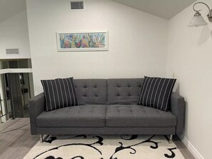 Sofa converts to Futon Bed
