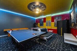 Themed games room showing ping pong table,air hockey, arcade