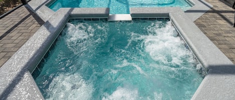 Pool area showing spa and jacuzzi jets working.