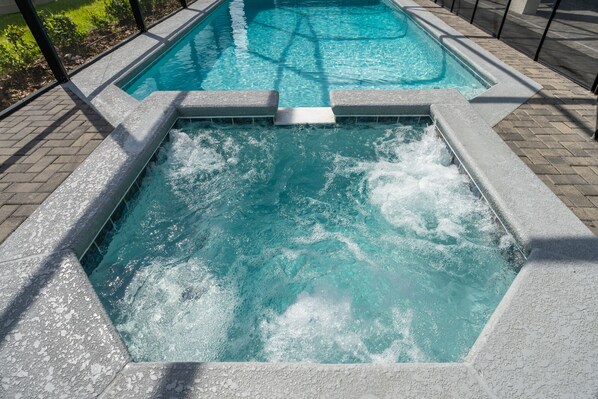 Pool area showing spa and jacuzzi jets working.