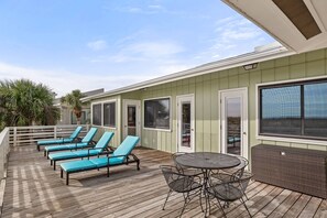 Back deck with loungers and dining area