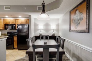 Full Kitchen and separate dining area with a large table for six.