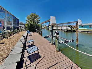 Waterfront Home with Boat Lift + Fishing table