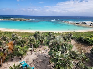 Home is on a sandy beach within a cove on the Atlantic Ocean.