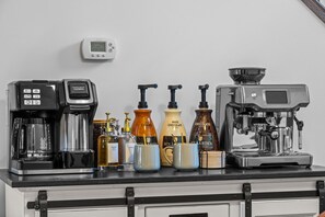 Coffee bar with espresso beans and grinder, flavored syrups and more. Bring your favorite KCups.