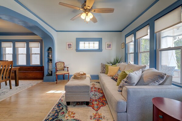 The open, airy layout effortlessly flows into a spacious dining room.