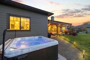 Soak into relaxation in your private hot tub under breathtaking starry skies.