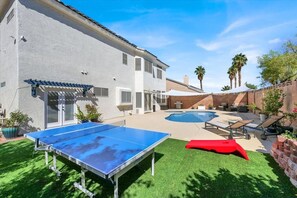 Backyard Bliss: Poolside Retreat with Ping Pong Fun
