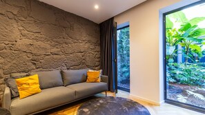 Bathed in natural light streaming through floor-to-ceiling windows, the open-concept space is an oasis of modern elegance #stunning #oasis