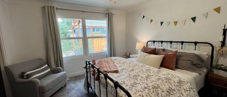 Guest room 1 with queen bed and Smart TV