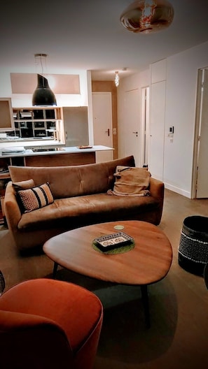 view looking back towards front door, kitchen and living area