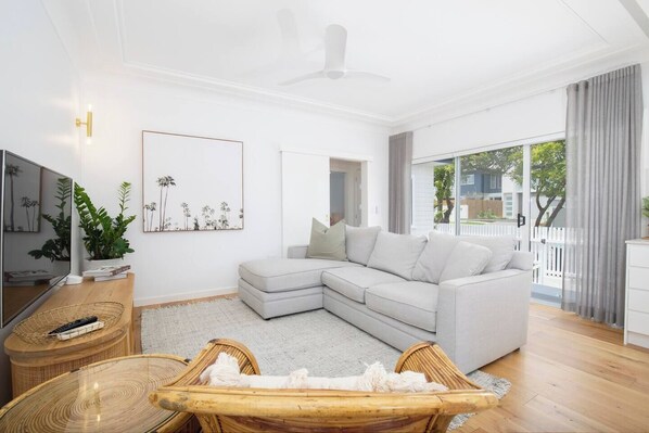 In the evenings, relax in the lounge room with spacious sofa seating and a central TV.